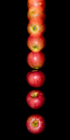 a timelapse photo of an apple falling