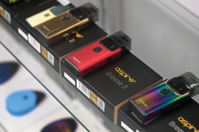 a photo of small rectangular e-cigs for sale on a store shelf